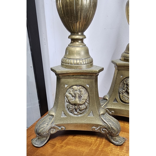 84 - A stunning pair of large antique ecclesiastical brass candlesticks, each measuring 60cm.