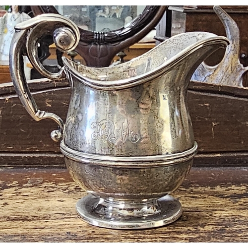 94 - An antique Sterling Silver jug, produced by J Wilmot, fully hallmarked for Birmingham, weighing 97g.