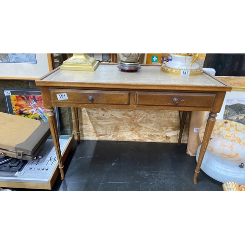 151 - A vintage coffee table with leather inset and two drawers.