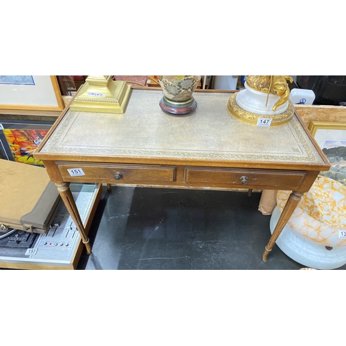 151 - A vintage coffee table with leather inset and two drawers.