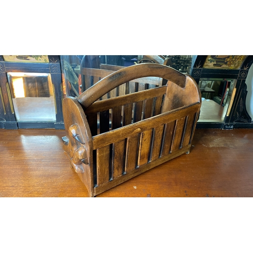 1 - A wooden magazine rack with decorative bird side panels.