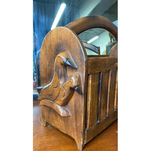 1 - A wooden magazine rack with decorative bird side panels.