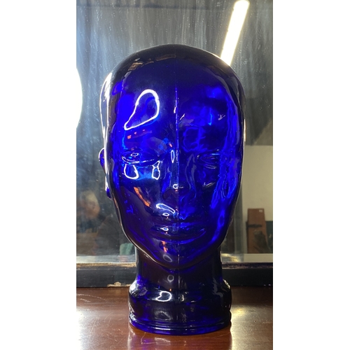 10 - A vintage blue glass shop display mannequin head.