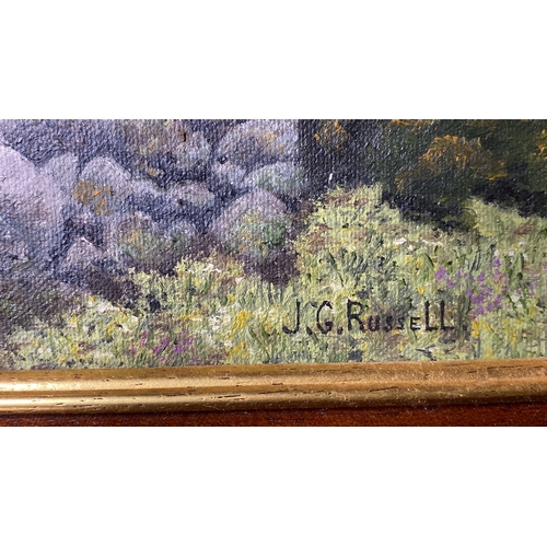 13 - A framed oil painting 'Bringing Home the Hay' signed J G Russell.