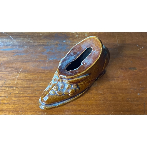 15 - A rare Early 19th Century ceramic money box in the style of a shoe.