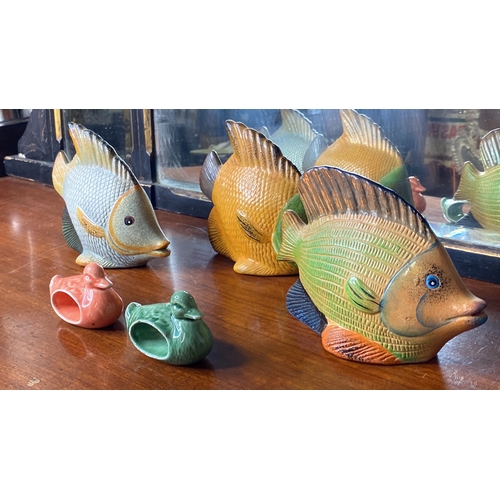 38 - Three ceramic fish ornaments and two ceramic duck napkin rings.