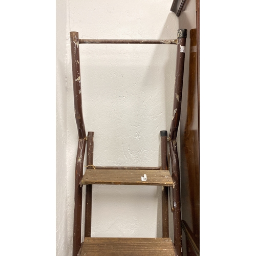 76 - A vintage folding step ladder.