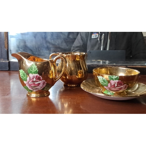 122 - A three piece Royal Winton 'Golden Age' tea set.