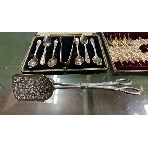 126 - Two vintage cased sets of silver plated teaspoons and sugar nips and more.