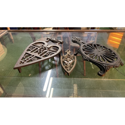 153 - Three antique trivet/pot stands.