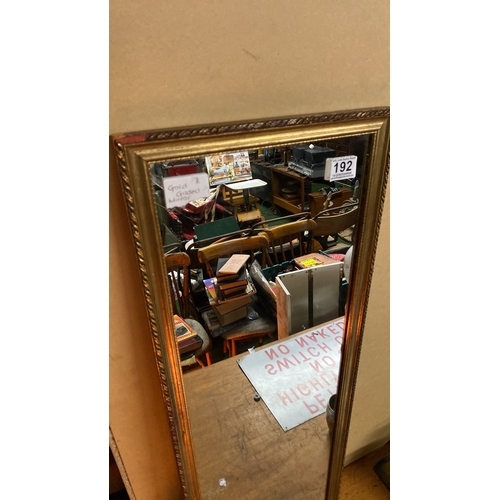 192 - A gilt framed wall mirror.