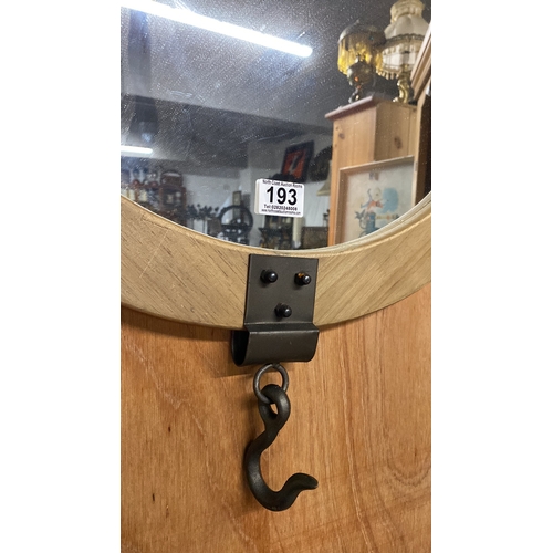 193 - An industrial style wooden framed wall mirror with hook.