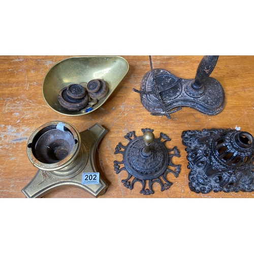 202 - An antique oil lamp base, brass scales and weights and more.