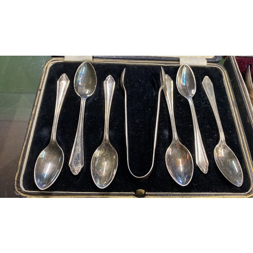 126 - Two vintage cased sets of silver plated teaspoons and sugar nips and more.