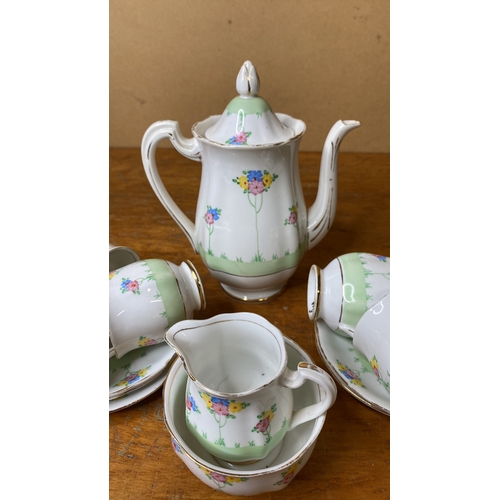 228 - A vintage Royal Standard coffee set with floral design.