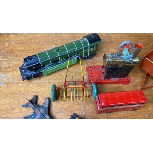 229 - A vintage Corgitronics 'London Bus', a Lintoy RAC Jaguar military plane, a vintage tinplate traction... 