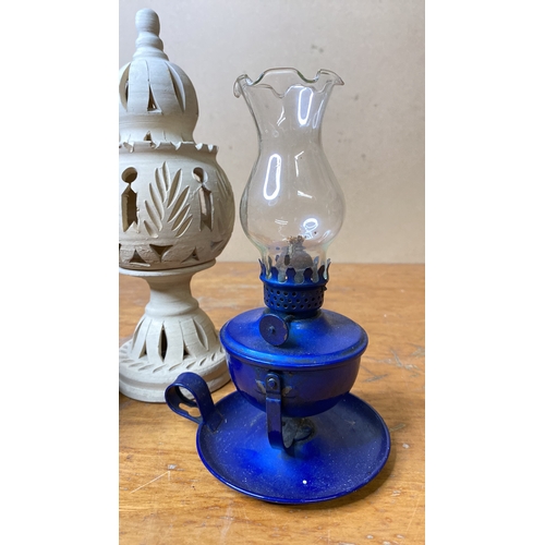 231 - Two ceramic tealight holders and a metal based finger lamp.