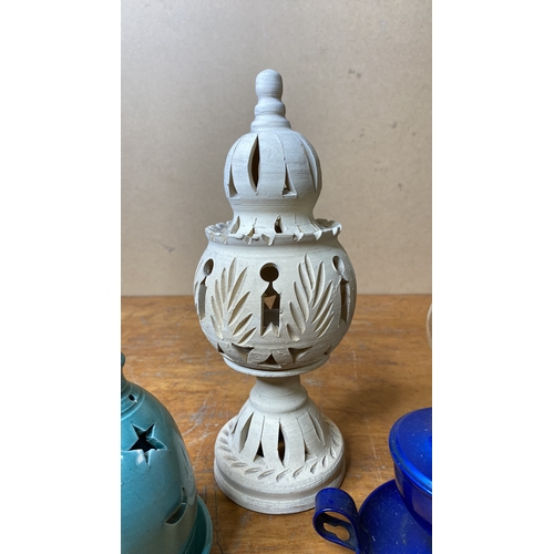 231 - Two ceramic tealight holders and a metal based finger lamp.