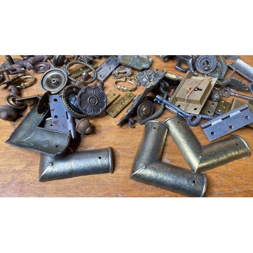 234 - An assorted lot of hinges, drawer pulls, brackets etc.