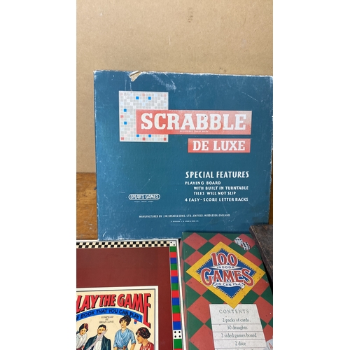 242 - A vintage Scrabble De Lux game, 100 Indoor Games and more.