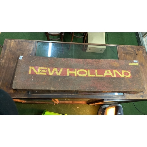 161 - A 'New Holland' metal panel. Measures 226cm x 35cm.