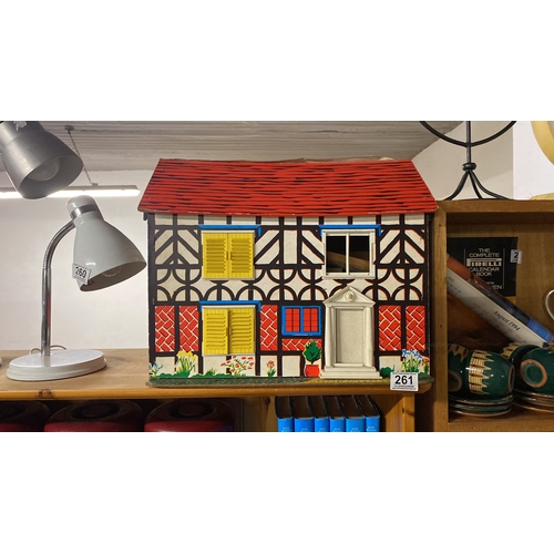 261 - A vintage dolls house.