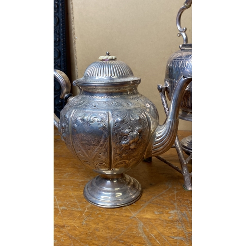 265 - A vintage silver plated spirit kettle and stand and two silver plated teapots.