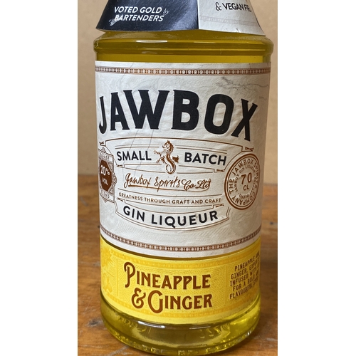 269 - A bottle of 70cl Jawbox Pineapple and Ginger gin and a bottle of 700ml Puerto de Indias gin.