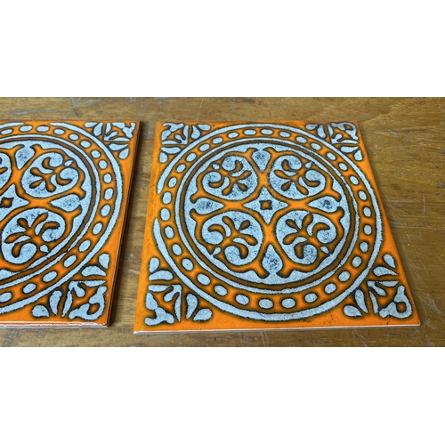 275 - A set of three vintage ceramic tiles.