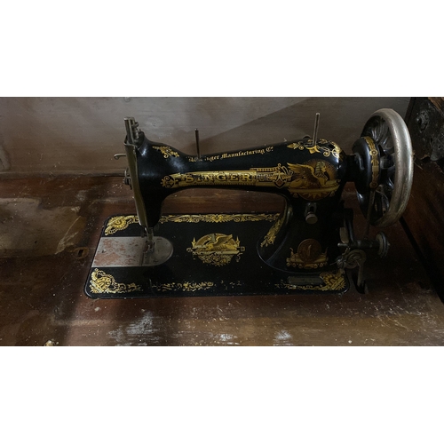 317 - An antique Singer Sewing Machine, no 73922 and cast iron base for restoration.