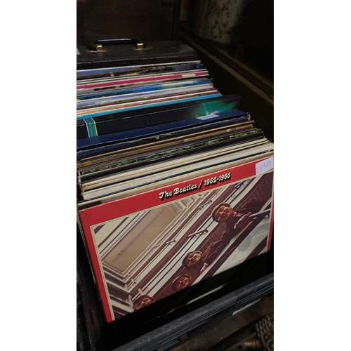 322 - A large collection of vintage record/albums to include the Beatles, Queen, Carpenters, Stockton's Wi... 