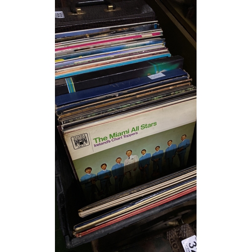 322 - A large collection of vintage record/albums to include the Beatles, Queen, Carpenters, Stockton's Wi... 