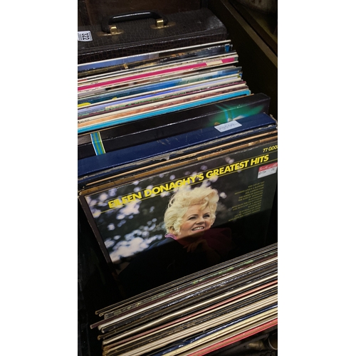 322 - A large collection of vintage record/albums to include the Beatles, Queen, Carpenters, Stockton's Wi... 