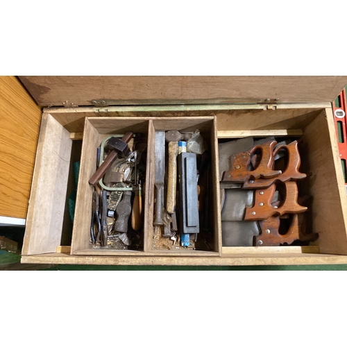 324 - Wooden tool chest containing assorted vintage hand tools, including various saws with wood handles, ... 