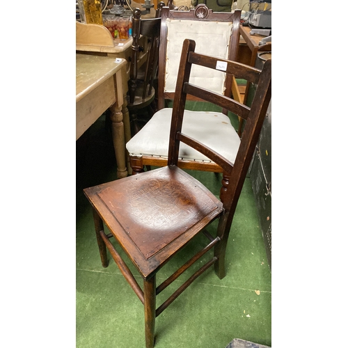 335 - A small wooden kitchen chair with fan detail on seat.