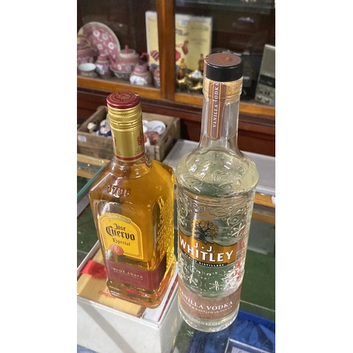 338 - A 70cl bottle of J J Whitley vanilla vodka and a bottle of 70cl Jose Cuervo's tequila.