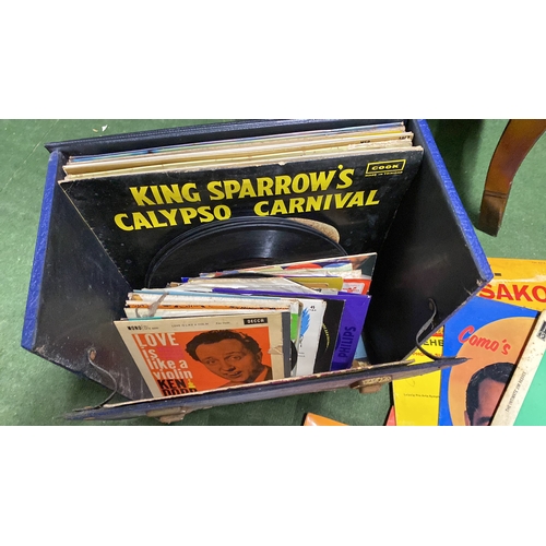 349 - A vintage record case and contents.