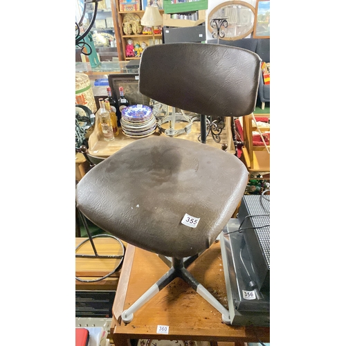 355 - A vintage swivel office chair.