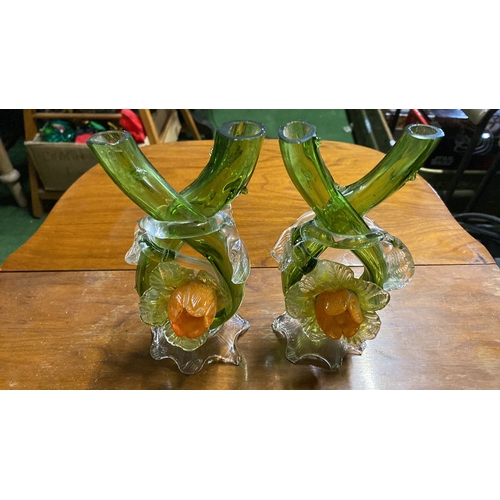 366 - A pair of unusual antique green glass candelsticks.