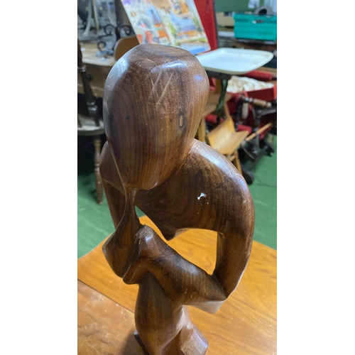 372 - An abstract carved wooden figure.