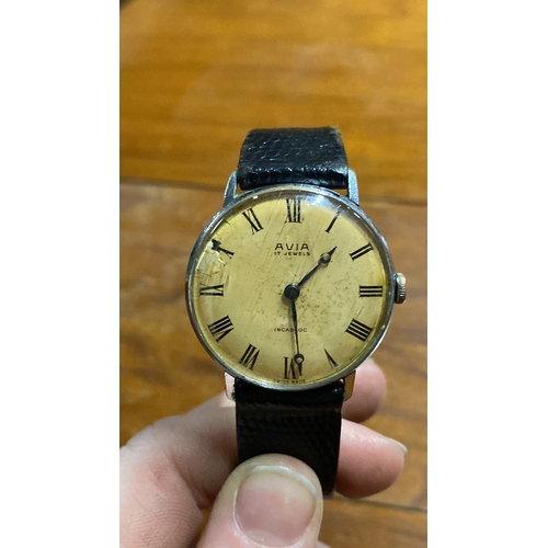 394 - A vintage AVIA wrist watch with leather strap.