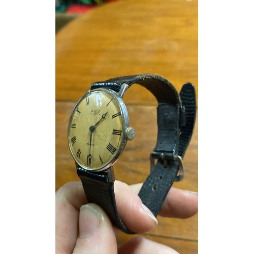 394 - A vintage AVIA wrist watch with leather strap.