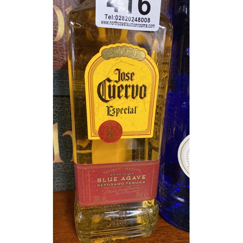 416 - A 70cl bottle of Jose Cuervo tequila and a 700ml 1885 Giffard Blue Curacao liqueur.