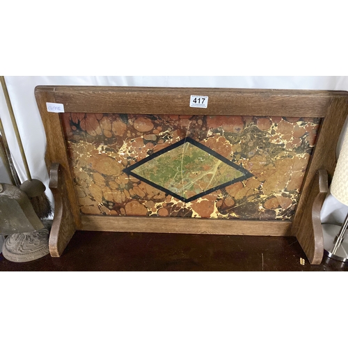 417 - A small oak framed overmantle/splash back, measuring 72cm x 41cm.