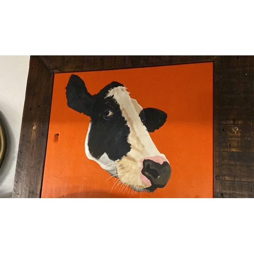 420 - A large framed painting of a cow.