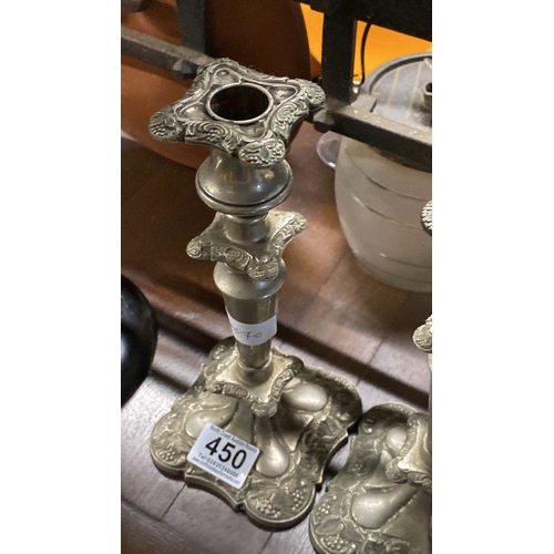 450 - A pair of silver plated candlesticks.