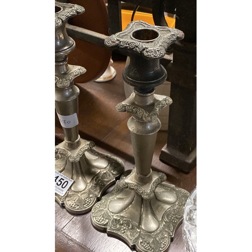 450 - A pair of silver plated candlesticks.