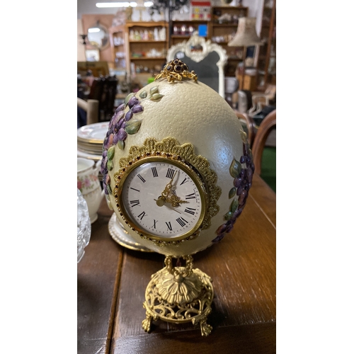 451 - A vintage pressed glass lidded bon bon dish and an Ostrich egg clock mounted on a gilt metal stand (... 