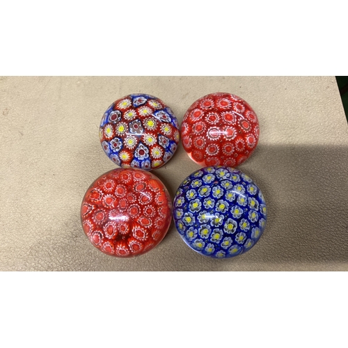 469 - Four vintage glass paperweights.