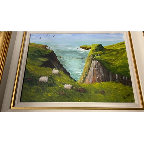 478 - A stunning framed oil 'Carrick-a-rede Rope Bridge' signed by Irish artist J White.